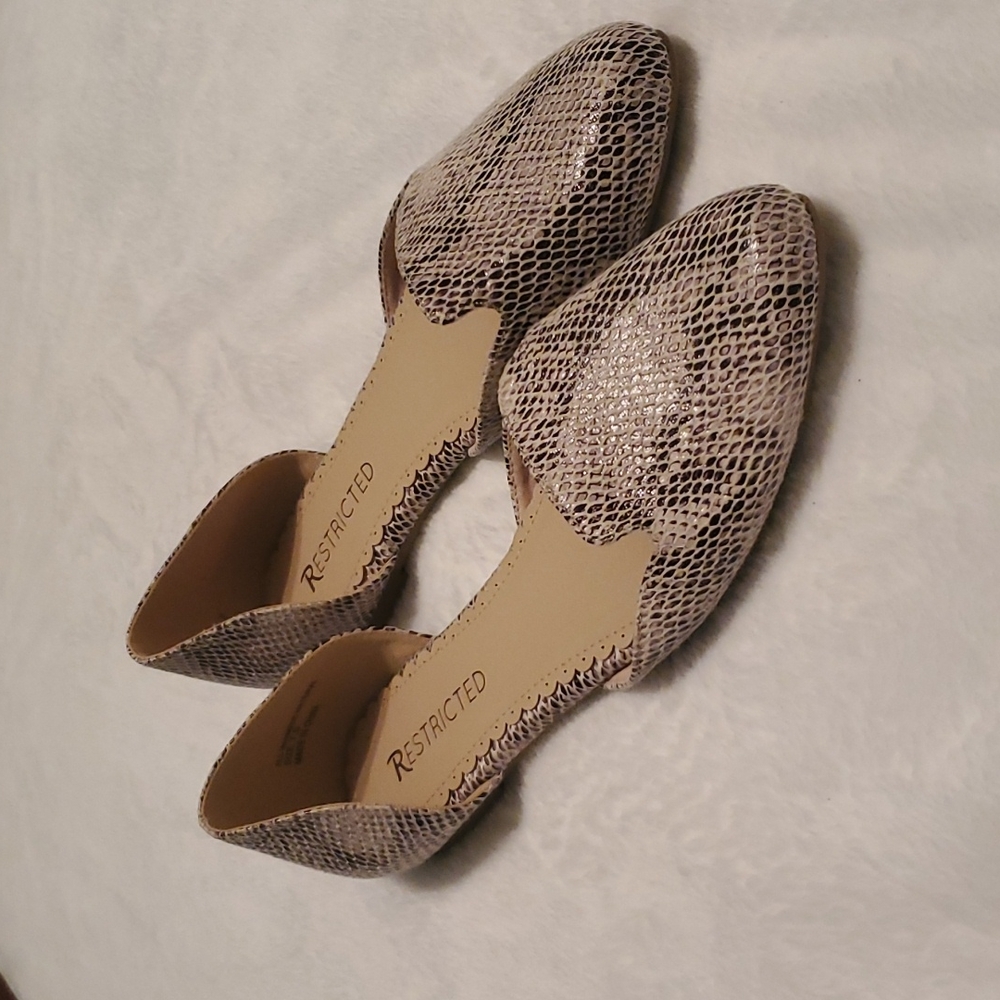 Restricted snake skin flats new never worn. Size 7.5